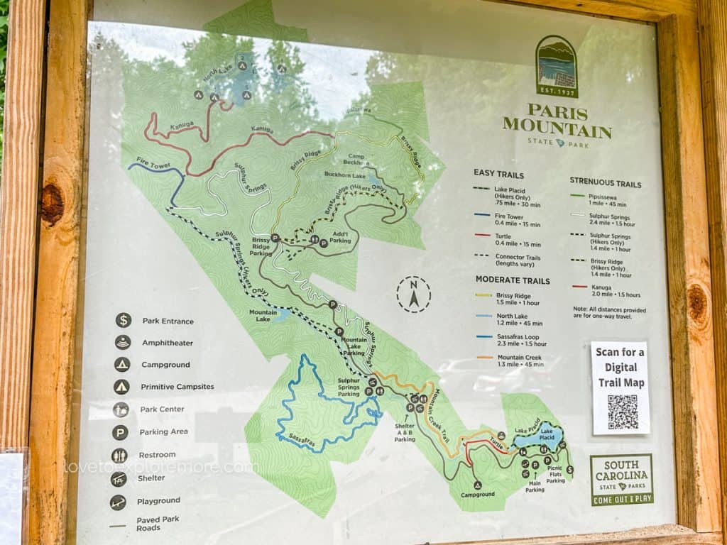 An informative map display at Paris Mountain State Park, outlining various trails and park features.