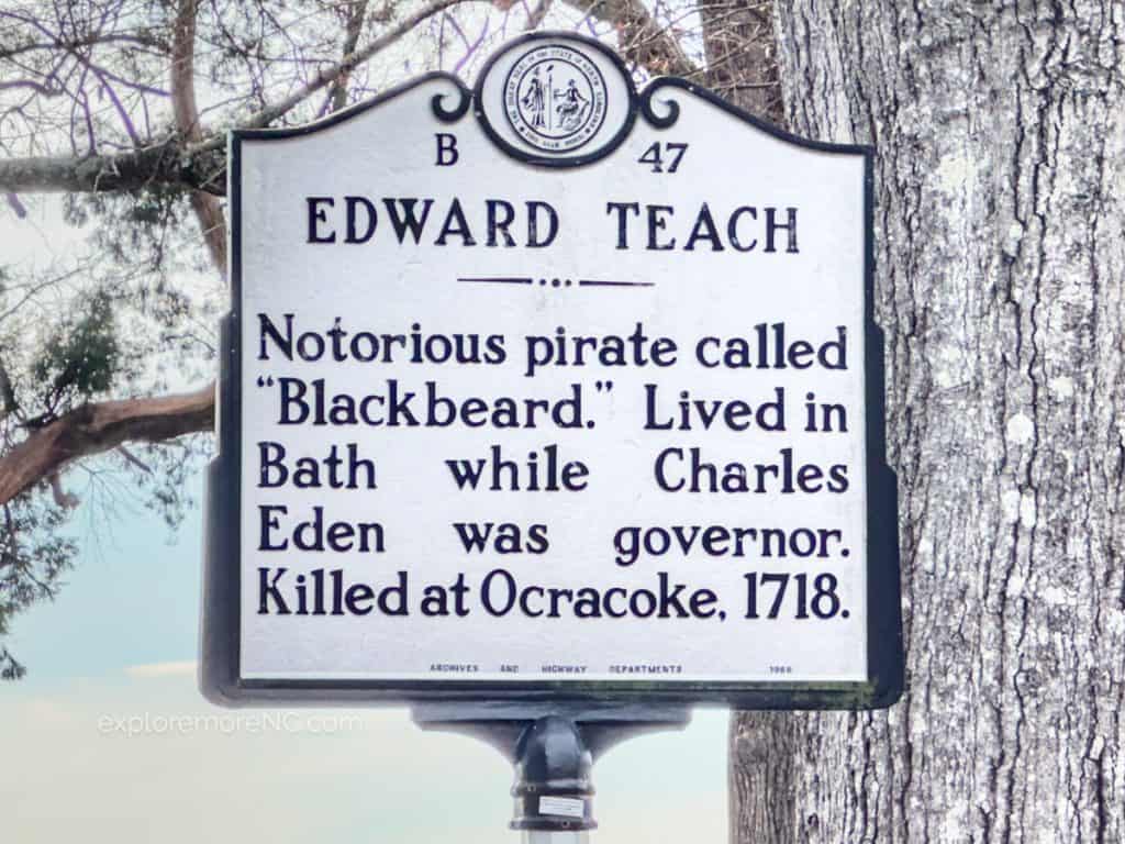Historic Sign in Bath NC that says Edward Teach, Notorious pirate called "Blackbeard." Lived in Bath while Charles Eden was govenor. Killed at Ocracoke 1718