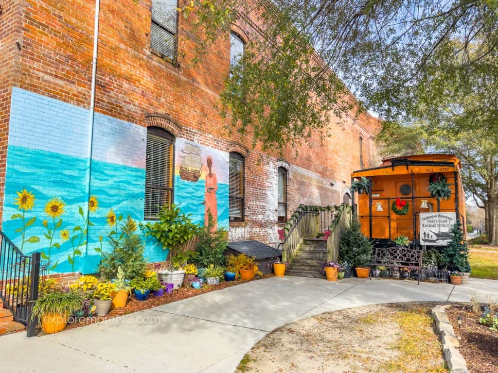Mural and train caboose for the Underground Railroad Museum