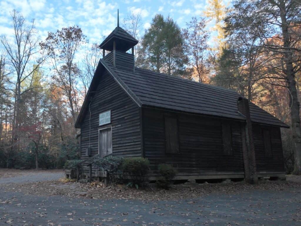 Old wooden Garden Creek Baptist Church in forested area